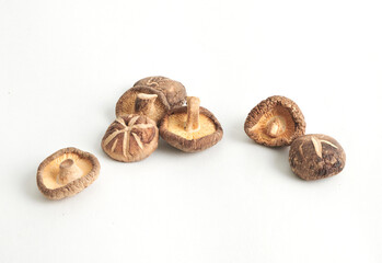 Shiitake mushrooms or lentinus edodes foods that are healthy, cultivated in Japan and China. Dried mushrooms isolated on white background. Full depth of field.