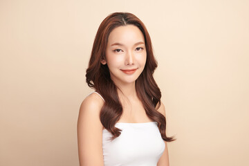 Beautiful young asian woman with clean fresh skin on beige background, Face care, Facial treatment, Cosmetology, beauty and spa, Asian women portrait.