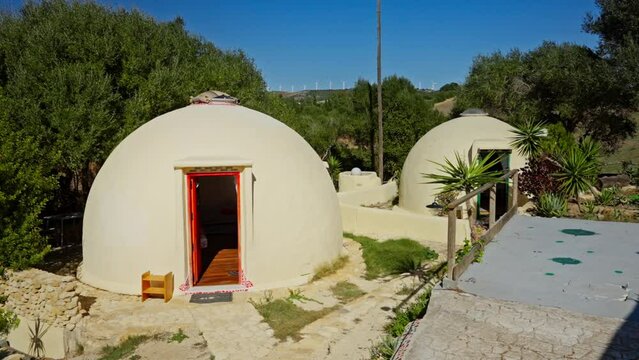 Beautiful outdoor small dome accommodation buildings in tropical environment. luxurious glamping.
