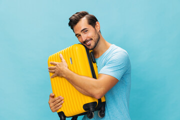 Baggage man happy traveler journey vacation studio travel background suitcase trip yellow flight