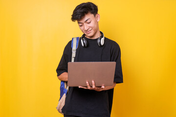 Asian college student boy using laptop. Education in high school university college concept.