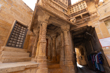 The castle is built of yellow sandstone. The streets are old and historic. Jaisalmer Fort (Sonar Quila or Golden Fort) is located in Rajasthan, India.