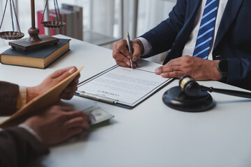 Government tax officials, legal advisers taking bribes of citizens wrapped in brown envelopes. Opening the annual tax evasion, the concept of bribing tax evader officials.