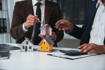 Real estate company to buy houses and land are delivering keys and houses to customers after...