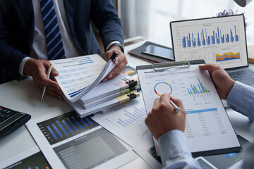 Asian male financial officer or accountant checking investment results Financial budget analysis...