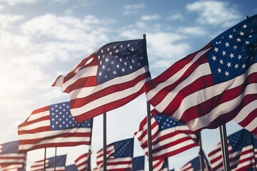 American flags fluttering in the wind against a clear sky on Patriot Day