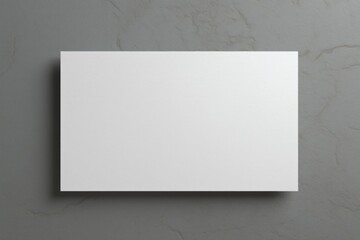 Blank white card hanging on a wall