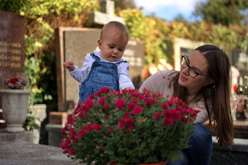 Mother and her baby girl on the grave