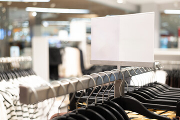blank sign inside shopping mall. mock up advertise display frame setting over the clothes line in...