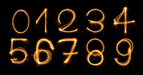 Fireworks numbers 0-9 Burning sparkler Numbers isolated on black background. Sparkler firework light alphabet number zero to nine. Numbers Alphabet of Sparklers to overlay on texture for happy design - obrazy, fototapety, plakaty