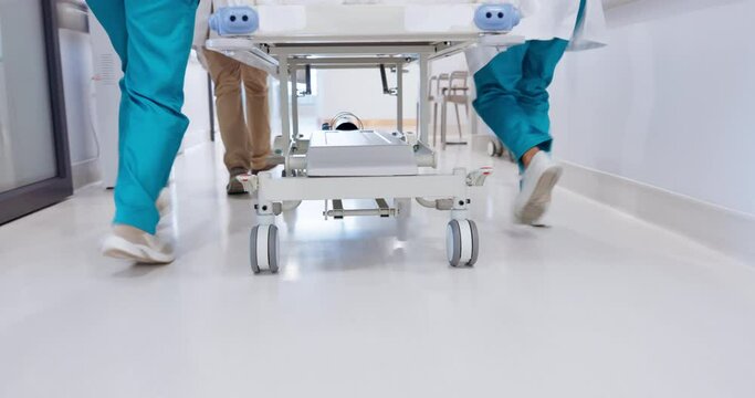 Group, doctor and legs running with bed for emergency, ICU or quick surgery to save a life at hospital. Closeup of medical people or shoes in rush with stretcher for healthcare, urgency or support