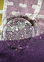 Manhole cover in the "Pink Alley" in Vancouver, Canada