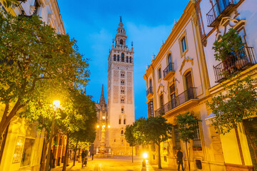 Giralda tower and Seville Cathedral in oldtown Spain - obrazy, fototapety, plakaty
