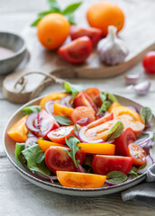 Green salad from leaves and tomatoes