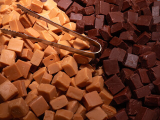 Closeup of mixture of dark and light chocolate fudge on a stall at a food market