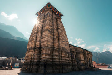Sun shining from behind the Kedarnath temple in India