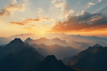 Fototapeta premium A Panoramic View of Towering Mountain Ranges at Sunrise