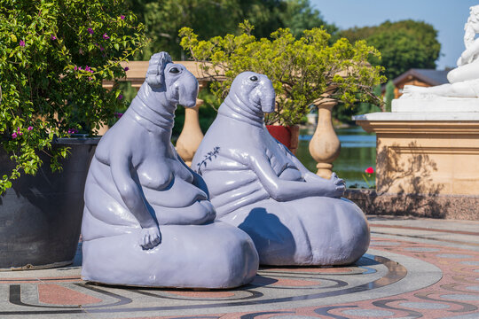 Modern sculpture Homunculus Loxodontus on the street in Kyiv, Ukraine. Eternally waiting humanoid monument