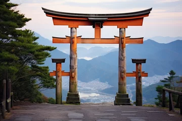 Gordijnen large wooden torii gate at the base of a mountain © Natalia