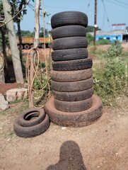 puncture shop  or puncture repair shop with many old tire and pressure pipe, nozzle.