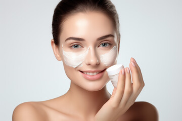 Fototapeta premium woman in spa applying black or white face mask for skin treatment