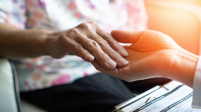 Parkinson disease patient, Alzheimer elderly senior, Arthritis persons hand in support of geriatric doctor or nursing caregiver for hospice palliative care, disability awareness day in aging society
