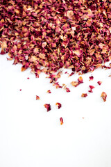 tea from rose petals on a white background, tea leaves, dried rose petals, drinking herbal tea