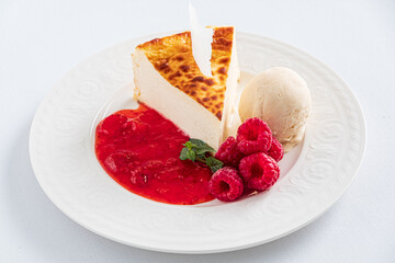 cheesecake with ice cream and raspberries