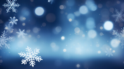 Christmas background in blue tones out of focus with white snowflakes in front