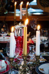 Christmas table with candles and flutes
