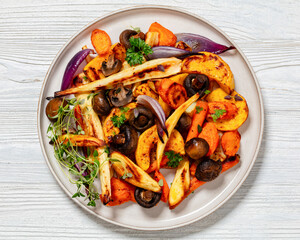 baked winter veggies and mushrooms on a plate