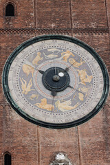 Clock on the Medieval Bell Tower of Cremona known as the Torrazzo, Lombardy, Italy.
