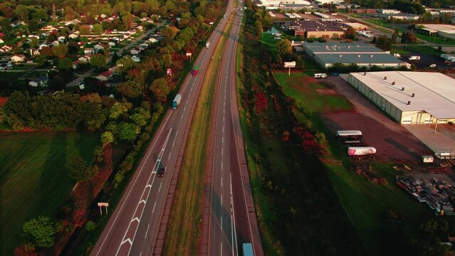 aerial view of interstate highway, capturing semi trucks in motion, commercial transport and logistics business