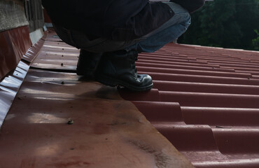 Wear safety shoes to ensure safety at work. construction workers wear safety shoes. People with factory safety concept