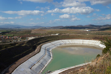 Liquid waste landfill surrounded by mountains