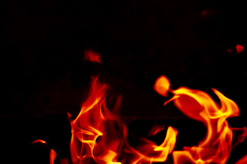 Fototapeta premium Background of the flame in the oven. Overlay layer. Tongues of fire in a fireplace.