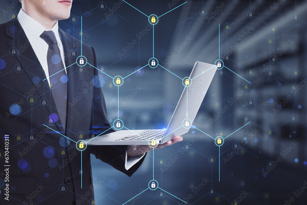Poster close up of businessman hand holding laptop with creative glowing hexagonal pattern with tiny padloc