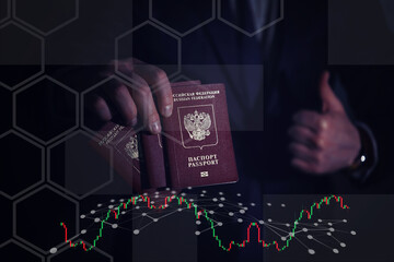 men's hands hold a red foreign Russian passport against the background of themselves in a suit, their faces are not visible. close-up