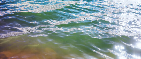 Water surface. The texture of the water. Waves on the lake in windy weather.