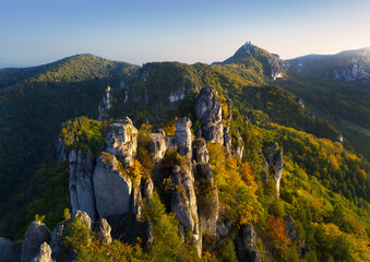 Colorful trees in autumn forest at Sulov rocks. Mountain landscape nature in Slovakia - aerial view