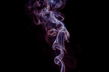 The steam color smoke of in movement on a black background. It is abstract.