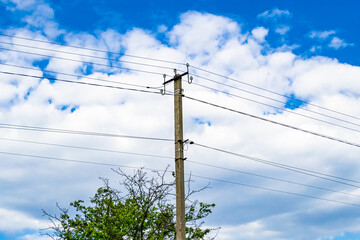 Power electric pole with line wire on colored background close up