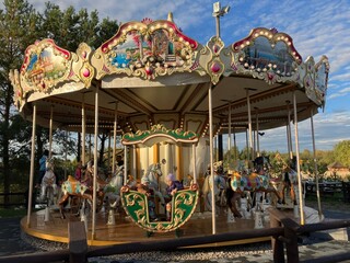 Krasiejow, Poland, 29 October 2023: old historically merry-go-rounds, children and a sunny day