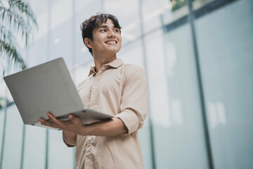 Photo of young Asian business people working outdoor