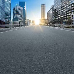 Asphalt road with modern buildings and skyscrapers