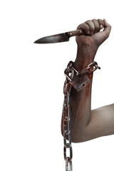The hand of a scary zombie with blood and wounds holding a knife while tied to the iron chain