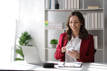 Attractive businesswoman working in the office.