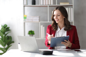 Attractive businesswoman working in the office.