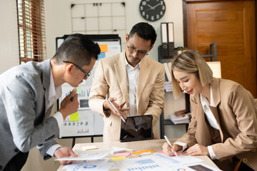 Asian businessmen, women and men Talk about new projects, presents at home office.