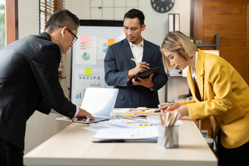Asian businessmen, women and men Talk about new projects, presents at home office.